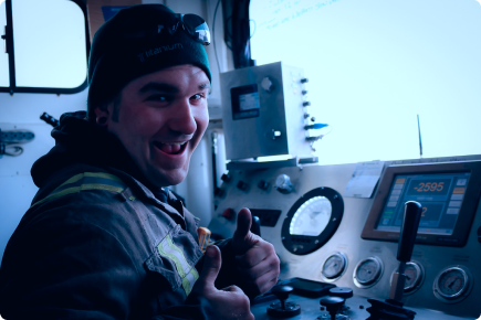 Smiling worker thumbs up